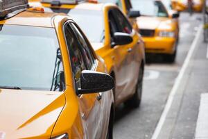 Classic street view of yellow cabs in New York city photo