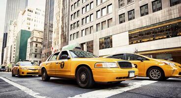 Classic street view with yellow cabs in New York City photo