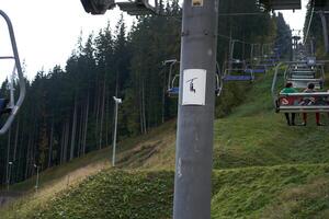 Bukovel, Ukraine October 2020 Ski lift in Carpathians mountains photo