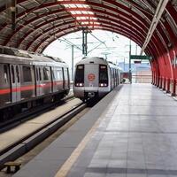 New Delhi India - October 09 2023 - Delhi Metro train arriving at Jhandewalan metro station in New Delhi, India, Asia, Public Metro departing from Jhandewalan station photo