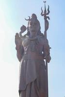 Big statue of Lord Shiva near Delhi International airport, Delhi, India, Lord Shiv big statue touching sky at main highway Mahipalpur, Delhi photo