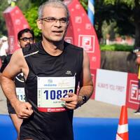 New Delhi, India - October 15 2023 - Vedanta Delhi Half Marathon race after covid in which marathon participants about to cross the finish line, Delhi Half Marathon 2023 photo