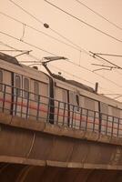 New Delhi, India, February 17 2024 - Delhi Metro train arriving at Jhandewalan metro station in New Delhi, India, Asia, Public Metro departing from Jhandewalan station photo