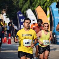 New Delhi, India - October 15 2023 - Vedanta Delhi Half Marathon race after covid in which marathon participants about to cross the finish line, Delhi Half Marathon 2023 photo