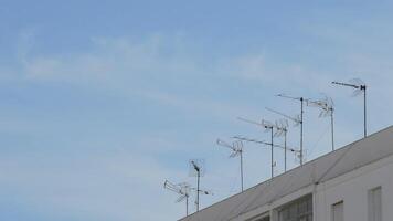 Antennas receiving television signal on the roof of a building video