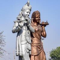 Big statue of Lord Radha Krishna near Delhi International airport, Delhi, India, Lord Krishna and Radha big statue touching sky at main highway Mahipalpur, Delhi photo