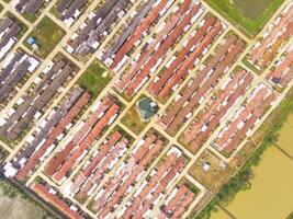 Public houses in Bandung City from drone. Aerial drone view of public housing on the edge of the city. View from above, Housing Development. Above. Social issues. Shot from drone flying 100 meters photo