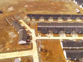 Public houses in Bandung City from drone. Aerial drone view of public housing on the edge of the city. View from above, Housing Development. Above. Social issues. Shot from drone flying 100 meters photo