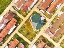 Public houses in Bandung City from drone. Aerial drone view of public housing on the edge of the city. View from above, Housing Development. Above. Social issues. Shot from drone flying 100 meters photo