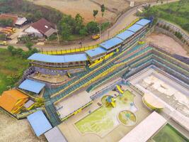 Aerial Photography. Landscape view from above the empty swimming pool. The swimming pool is deserted, uninhabited and dirty. Shot from a drone flying 200 meters high photo