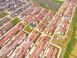 Housing Development in Bandung City - Indonesia. Aerial drone view of public housing on the edge of the city. View from above, Housing Development. Above. Social issues. Shot from drone flying photo