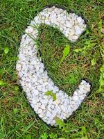 The letter C is an alphabet of white gravel stones. photo