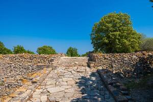 Troy ancient city ruins. Stone road of acropolis of Troy. photo