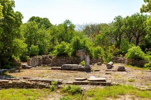 Ruins of Troy ancient city and trees in the spring photo