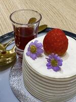 Exquisite cake with strawberry and flowers, perfect for high-end dessert menus and patisserie branding photo