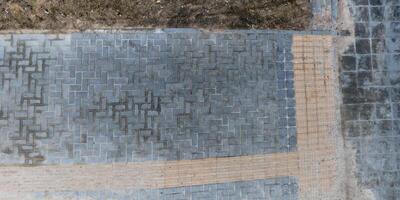 top view of the texture of paving slabs on pedestrian path photo