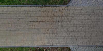 top view of the texture of paving slabs on pedestrian path photo