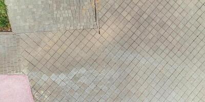 top view of the texture of paving slabs on pedestrian path photo