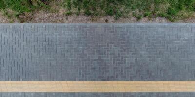 top view of the texture of paving slabs on pedestrian path photo