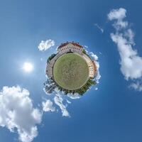little planet and spherical aerial 360 panorama view on street ancient medieval castle with church and historic buildings with columns photo