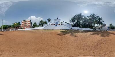 hdri 360 panorama of portuguese catholic Immaculate Conception Church with stairs in jungle among palm trees in Indian town in equirectangular projection. VR AR content photo
