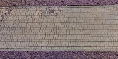 top view of the texture of paving slabs on pedestrian path photo