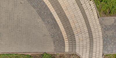 top view of the texture of paving slabs on pedestrian path photo