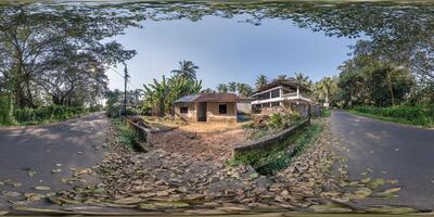 full seamless spherical hdr 360 panorama view among green street with cottages, villas and coconut trees in an indian tropic village in equirectangular projection, ready for VR AR virtual reality photo