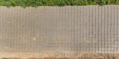 top view of the texture of paving slabs on pedestrian path photo