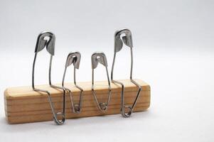 Safety pin represent family talking and sitting on wooden block with customizable space for text photo