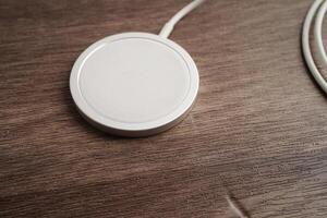 Wireless charger, magnetic charging modern equipment of mobile phone. photo