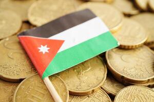 Jordan flag on coin and banknote money, finance trading investment business currency concept. photo