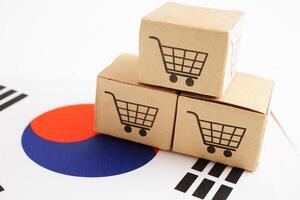 Online shopping, Shopping cart box on South Korea flag, import export, finance commerce. photo