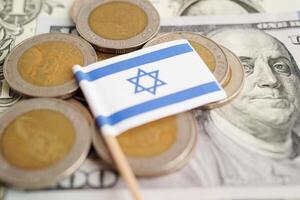 Israel flag on coin and banknote money, finance trading investment business currency concept. photo
