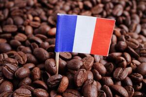 France flag on coffee beans, shopping online for export or import food product. photo