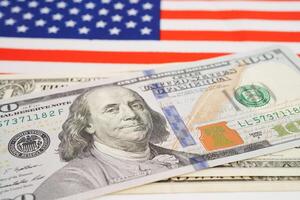 America flag with US dollar banknote, finance banking concept. photo