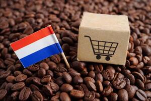 Netherlands flag on coffee beans, shopping online for export or import food product. photo