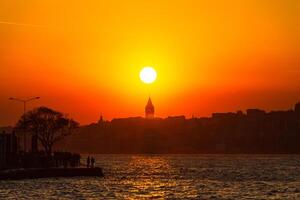 Galata Tower with sunset view from Uskudar district photo