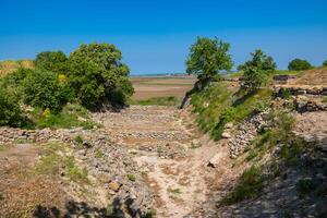 Schliemann's trench in Troy ancient city ruins. Visit Turkey concept photo