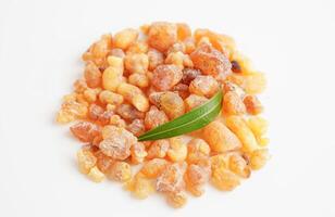 Frankincense or olibanum aromatic resin isolated on white background used in incense and perfumes. photo