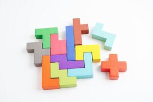 Logical thinking and problem solving problem solution creative business concept, wooden puzzle geometric block shape. photo