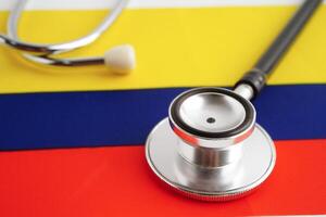 Colombia flag with black stethoscope, Business and finance concept. photo