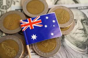 New Zealand flag on coins background, finance and accounting, banking concept. photo