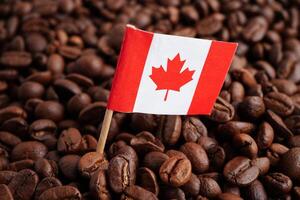 Canada flag on coffee beans, shopping online for export or import food product. photo