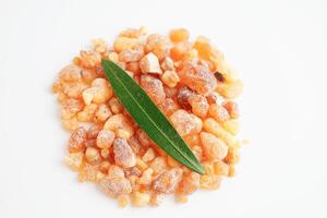 Frankincense or olibanum aromatic resin isolated on white background used in incense and perfumes. photo