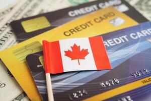 Canada flag on credit card, finance economy trading shopping online business. photo