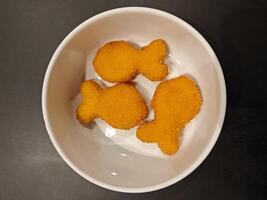 Crispy Fish Shaped Chicken Nuggets for the kid menu. photo