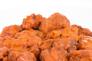 Boneless chicken wings with buffalo sauce and carrots photo