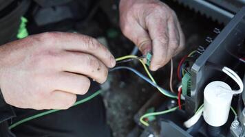 Electrician installs wiring using Connectors for connecting wires in automation and electronics equipment. Connection of electrical wires of electrical appliances video