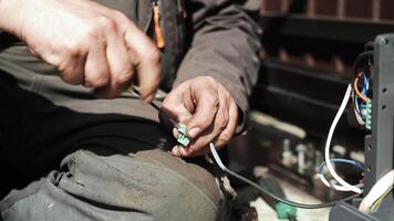 Electrician installs wiring using Connectors for connecting wires in automation and electronics equipment. Connection of electrical wires of electrical appliances video